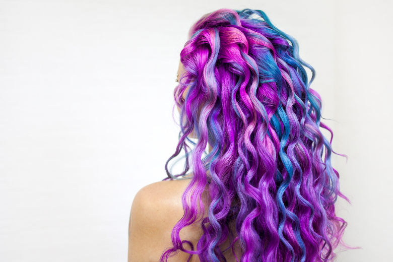 Vibrant purple and blue curly hair