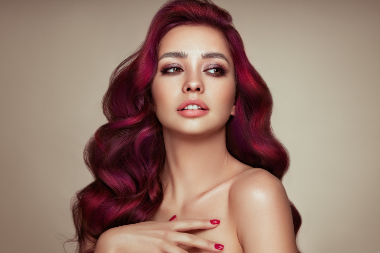 Woman with long wavy burgundy hair